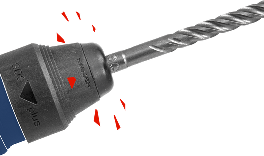 Rotary hammer drill bit attached to a chuck for heavy-duty drilling tasks.