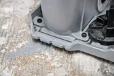 Wall chaser base resting on a dusty concrete surface.